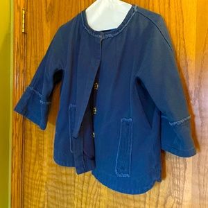 Waist length blue corduroy jacket with fringe detail